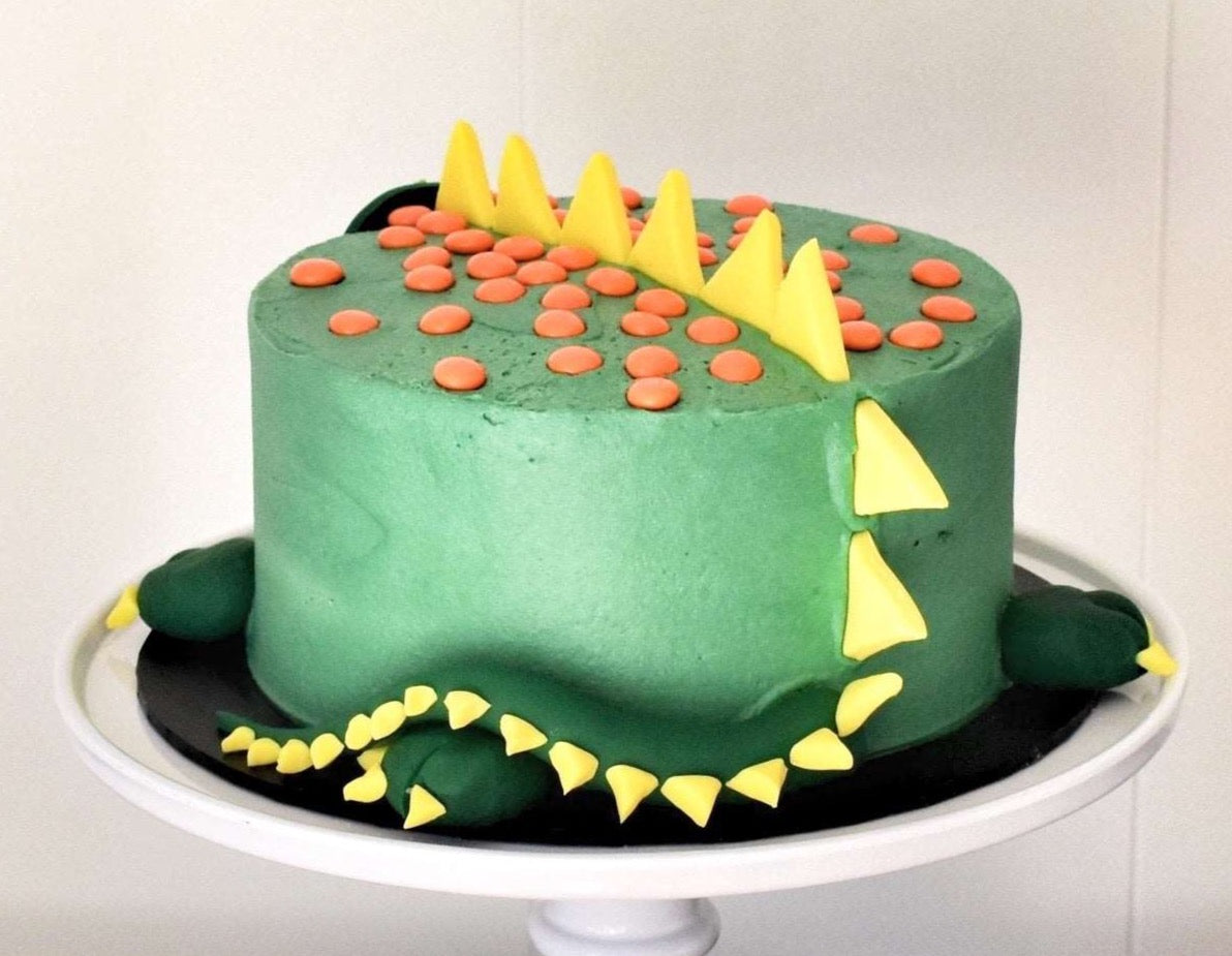 Dino dig site cake for my son's 3rd birthday: lemon layer cake with  strawberry compote, dark chocolate ganache and a marsipan stegosaurus :  r/Baking